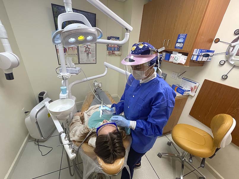 Preventive dentistry appointment with a patient receiving a routine dental checkup at Atlas Park Dental in Glendale, Queens